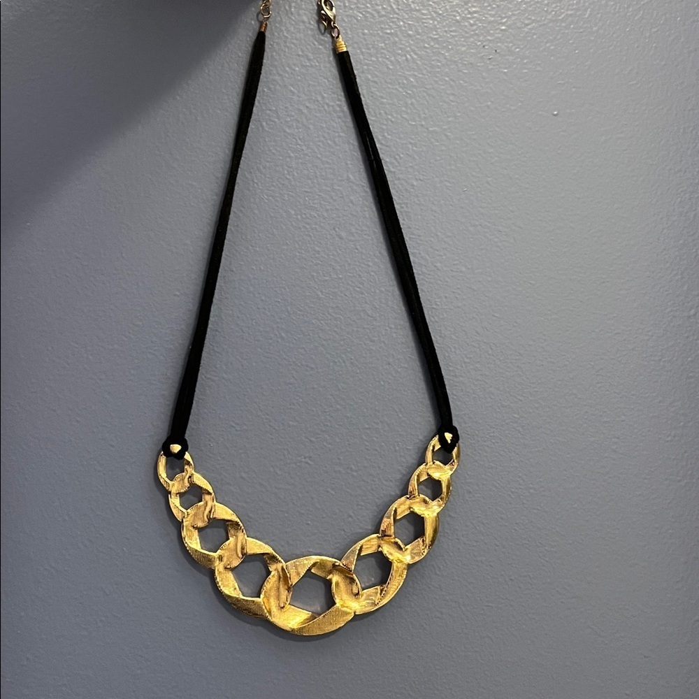 Gold tone metal and black cord Statement Necklace